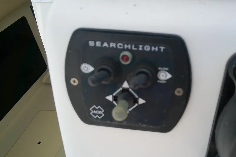 Slide: The Image of 2001 Boston Whaler 28 Outrage boat interior with seating and control panel. - 22