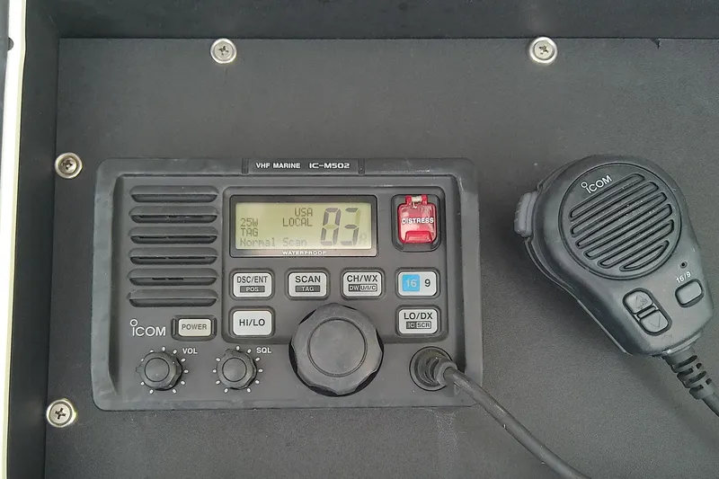 Slide: The Image of Boston Whaler 28 Outrage 2001 boat helm with Simrad electronics and steering wheel. - 27