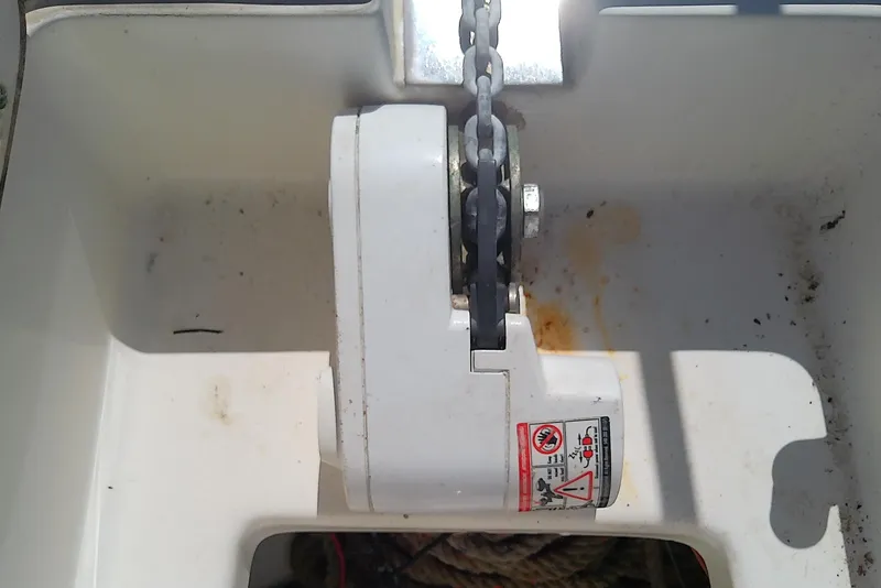 Slide: The Image of Anchor storage compartment on a 2001 Boston Whaler 28 Outrage boat. - 31