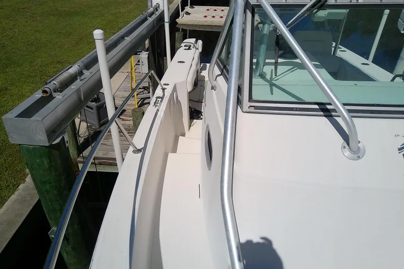 Slide: The Image of Helm of 2001 Boston Whaler 28 Outrage with Simrad electronics and steering wheel. - 33