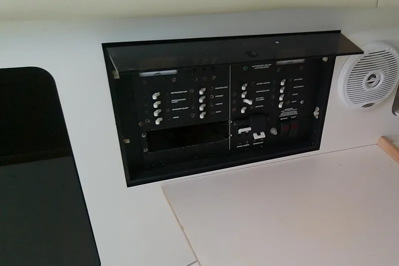 Slide: The Image of Interior cabin of 2001 Boston Whaler 28 Outrage with wood flooring and seating. - 37