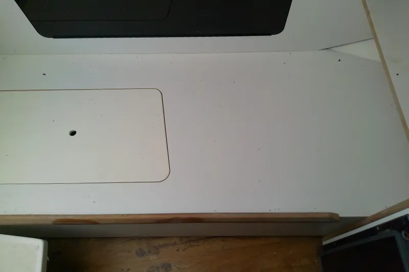 Slide: The Image of Open mini fridge on 2001 Boston Whaler 28 Outrage boat, containing a water bottle. - 38