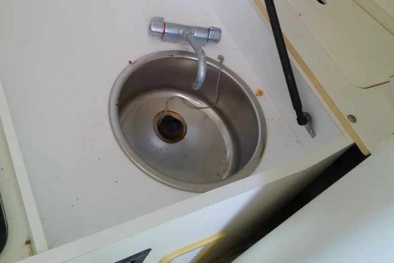 Slide: The Image of Microwave and control panel inside 2001 Boston Whaler 28 Outrage boat cabin. - 40