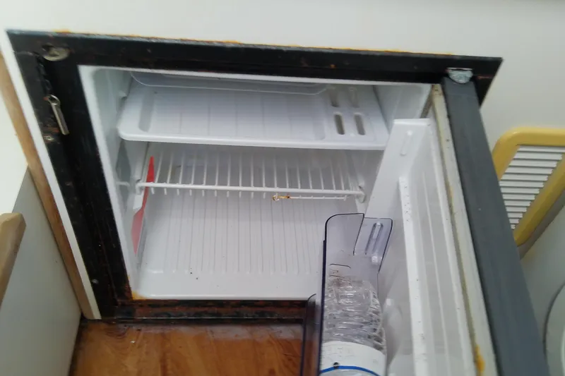 Slide: The Image of Warning sign on 2001 Boston Whaler 28 Outrage for air conditioner seacock operation. - 44