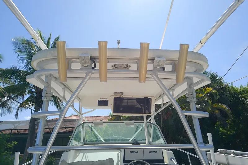 Slide: The Image of 2001 Boston Whaler 28 Outrage boat interior with canopy and control panel. - 6