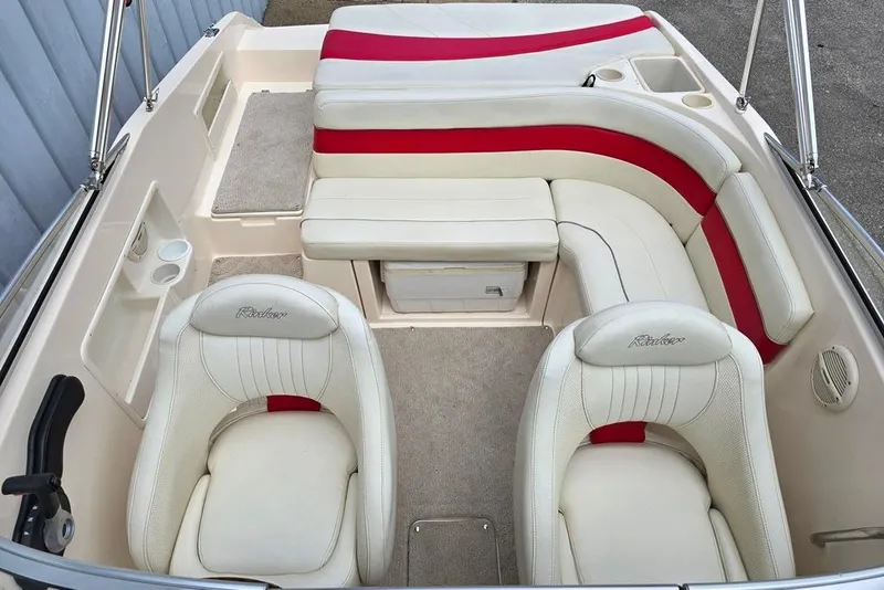 Slide: The Image of 2005 Rinker 192 Captiva BR boat interior with white and red seating. - 4