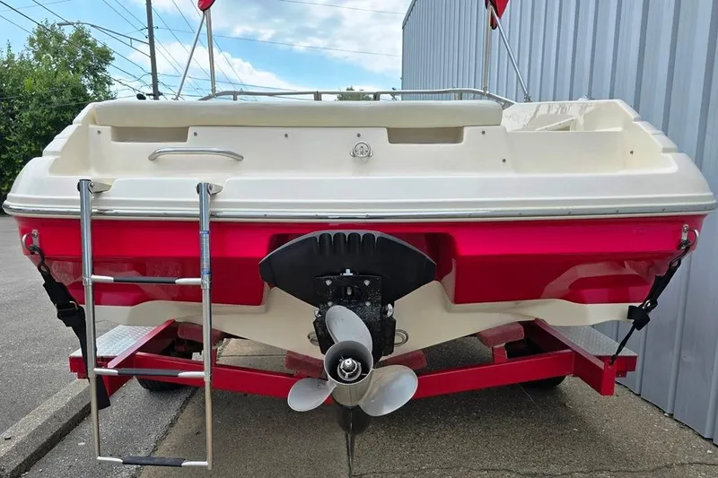 Slide: The Image of 2005 Rinker 192 Captiva BR boat rear view with propeller and ladder. - 6