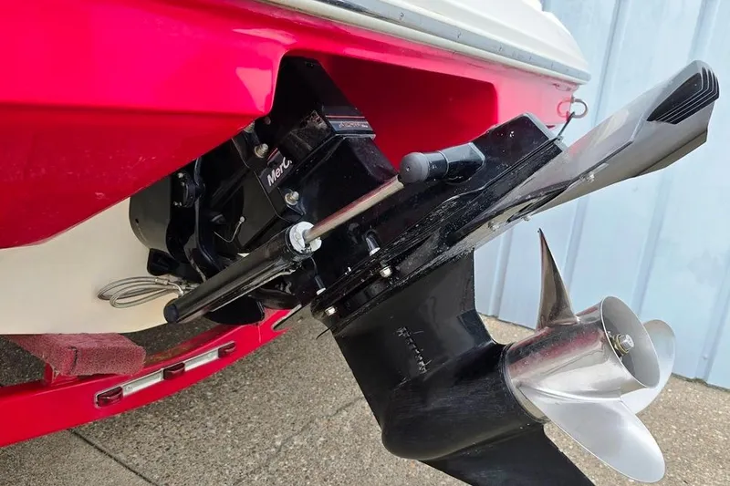 Slide: The Image of Close-up of a 2005 Rinker 192 Captiva BR boat's propeller and stern drive. - 7