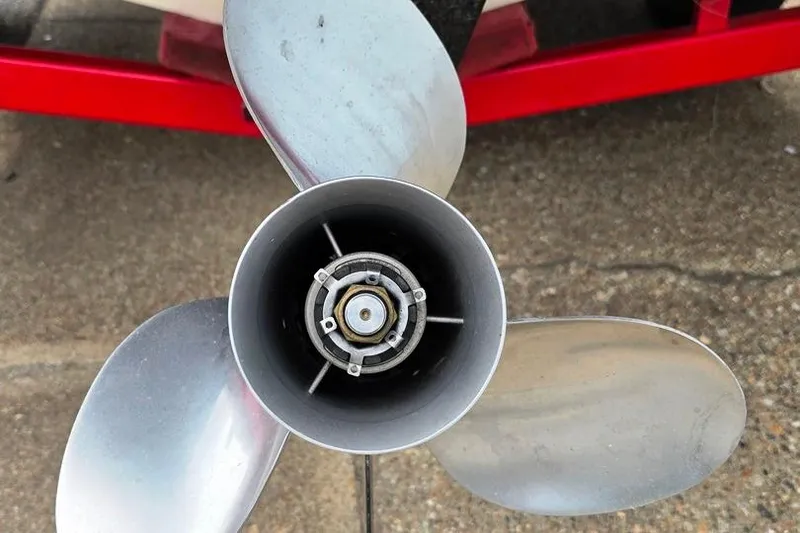 Slide: The Image of Propeller of a 2005 Rinker 192 Captiva BR boat on a red trailer. - 8