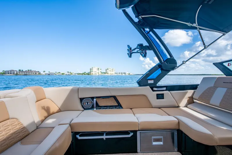 Slide: The Image of Luxurious interior of 2022 MasterCraft X26 boat with scenic waterfront view. - 14