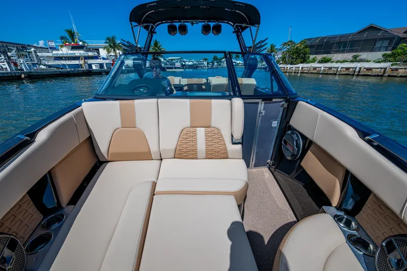 Slide: The Image of 2022 MasterCraft X26 boat interior with luxurious seating and modern design. - 22