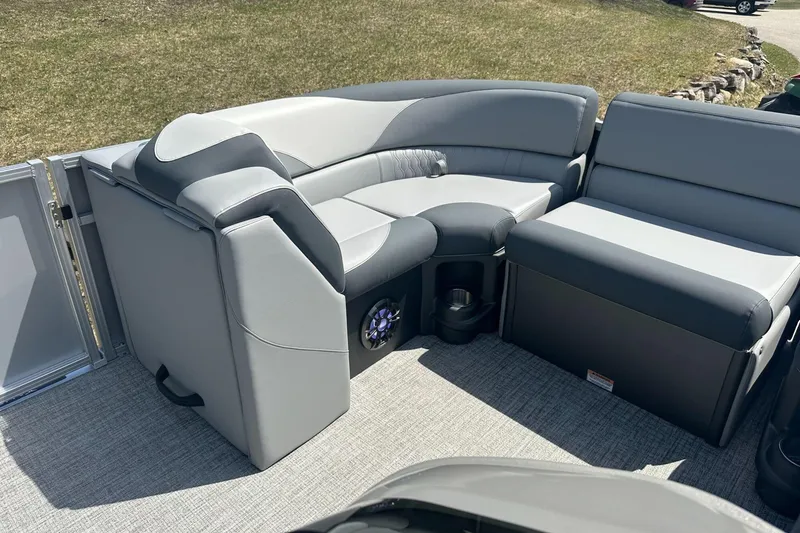 Slide: The Image of 2025 Tahoe 2185 boat interior with gray seating and cup holders. - 15