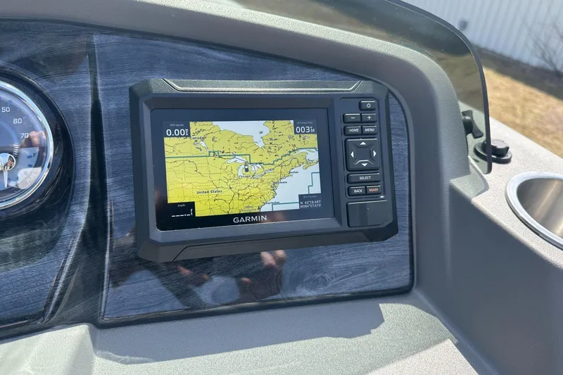 Slide: The Image of Garmin GPS display on 2025 Tahoe 2185 boat dashboard, showing navigation map. - 19