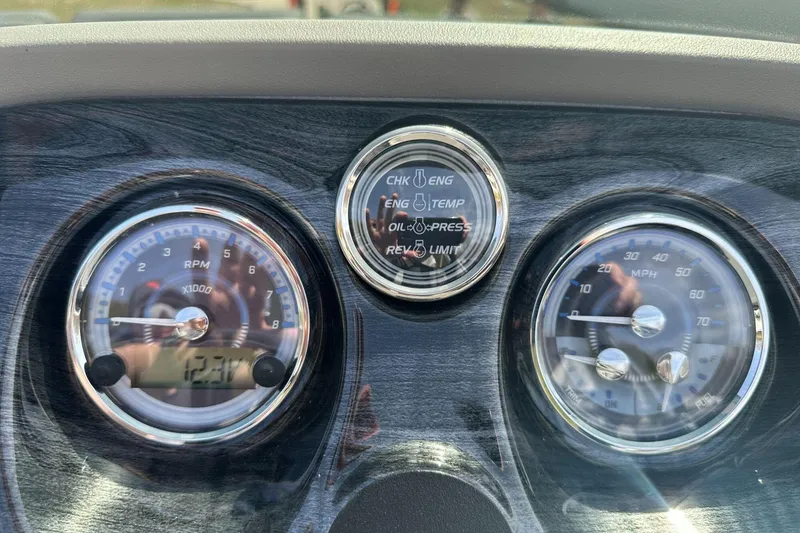 Slide: The Image of Dashboard of 2025 Tahoe 2185 with RPM and speedometer gauges. - 23
