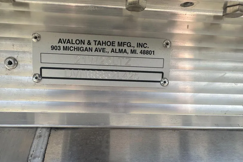 Slide: The Image of Metal plate with Avalon & Tahoe manufacturing details and serial numbers. - 27