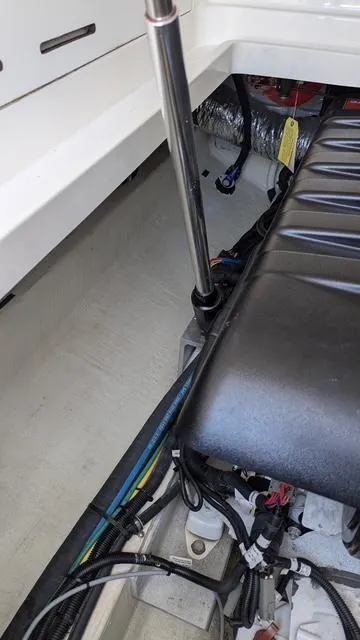 Slide: The Image of Interior view of a 2011 Back Cove 30 boat, showing seating and wiring details. - 13