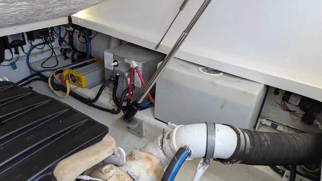 Slide: The Image of Engine compartment of a 2011 Back Cove 30 boat, showing wiring and components. - 15