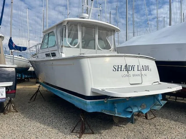 Slide: The Image of 2011 Back Cove 30 boat named "Shady Lady" on dry dock in Long Branch, NJ. - 2