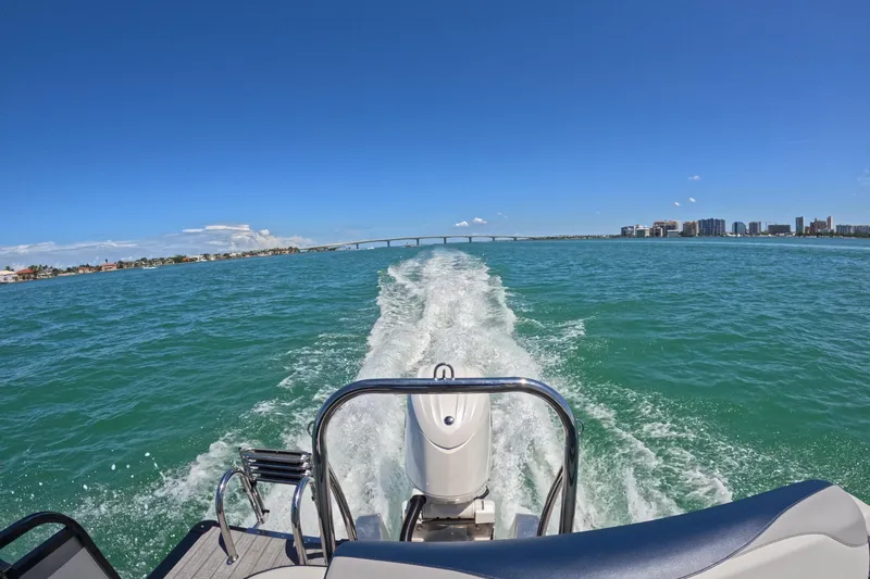 Slide: The Image of 2025 Avalon 2385 LSZ Versatile Rear Lounger cruising in Sarasota, FL waters. - 2