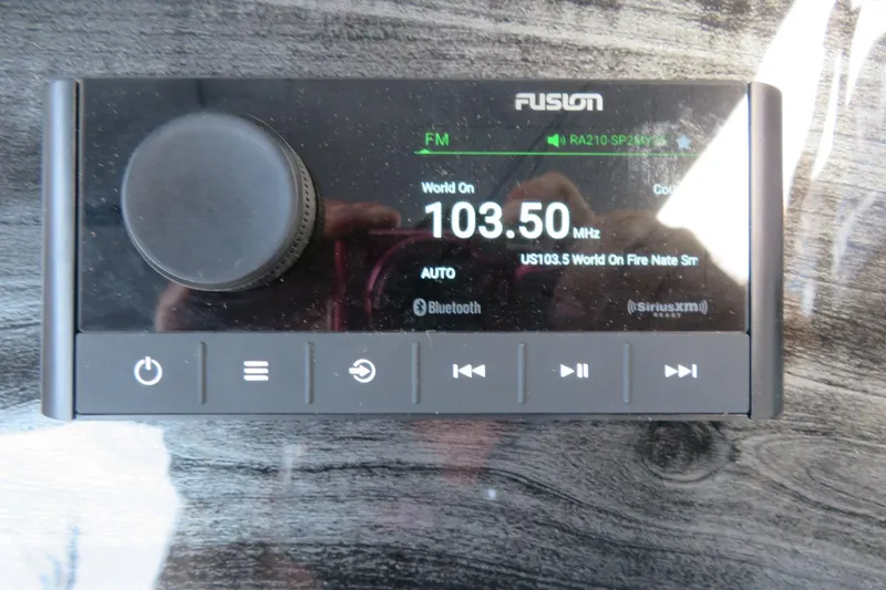 Slide: The Image of Fusion marine stereo display on Avalon 2385 LSZ Versatile Rear Lounger, 2025 model. - 61