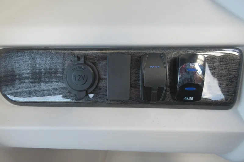 Slide: The Image of Control panel of 2025 Avalon 2385 LSZ Versatile Rear Lounger with marine 12V and bilge switch. - 62