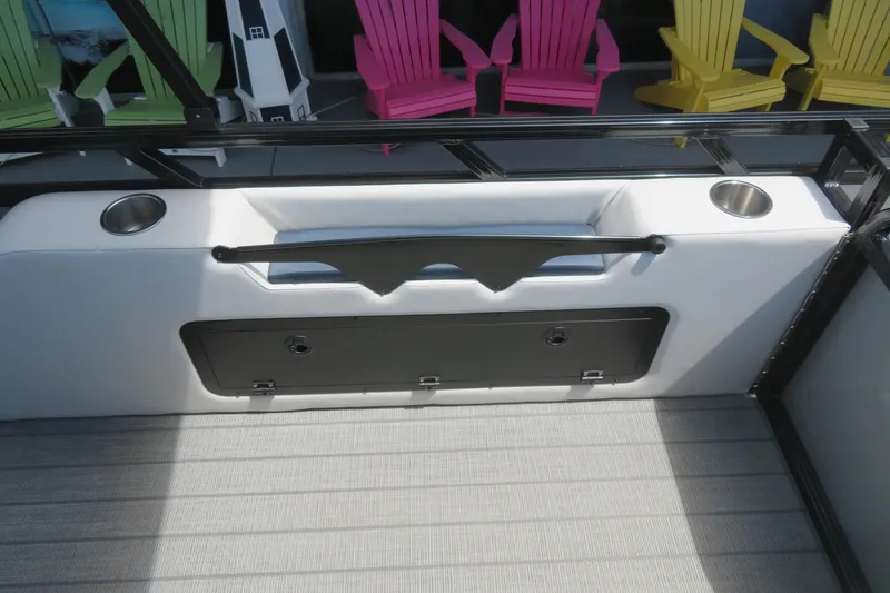 Slide: The Image of 2025 Avalon 2385 LSZ Versatile Rear Lounger interior with cup holders and colorful chairs. - 67