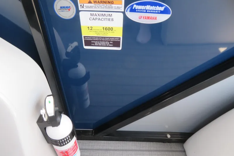 Slide: The Image of Fire extinguisher and capacity warning on 2025 Avalon 2385 LSZ Versatile Rear Lounger boat. - 74