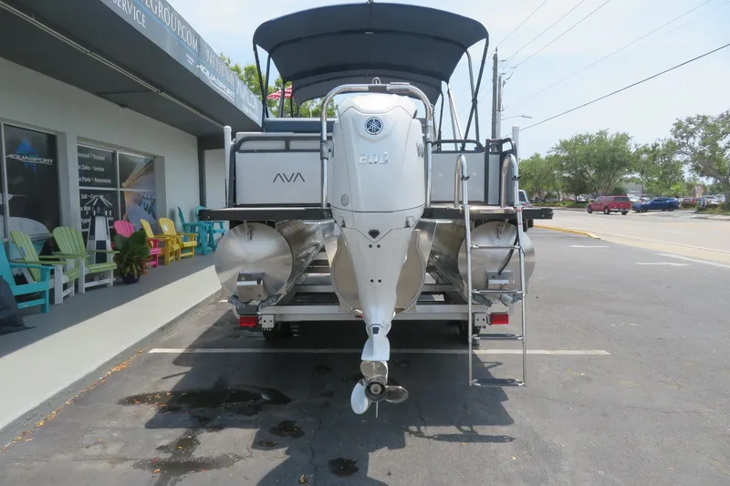 Slide: The Image of 2025 Avalon 2385 LSZ Versatile Rear Lounger luxury tri-toon boat in Sarasota, FL parking lot. - 86