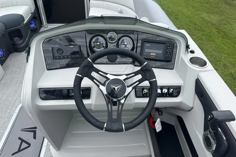 Slide: The Image of Steering console of 2025 Tahoe 2185 boat with modern controls and dashboard. - 18