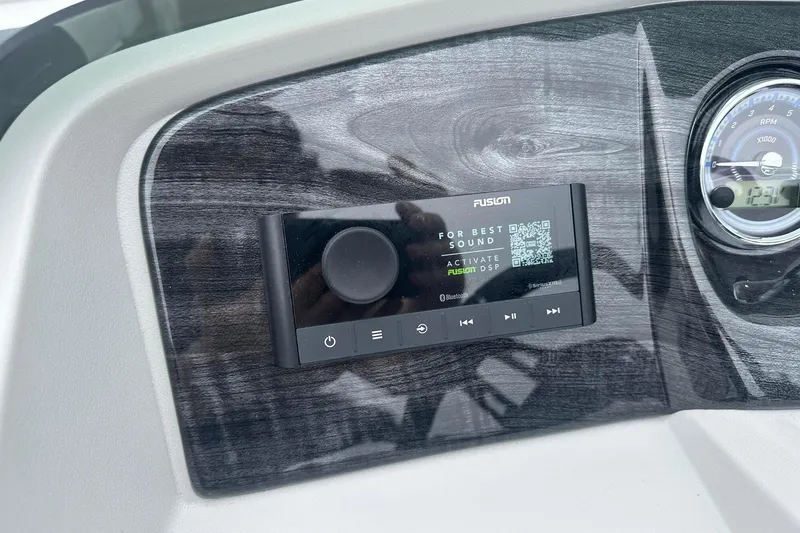 Slide: The Image of Dashboard of a 2025 Tahoe 2185 featuring a Fusion audio system and RPM gauge. - 20