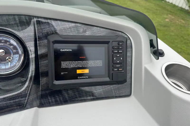Slide: The Image of Dashboard of a 2025 Tahoe 2185 with Garmin navigation system and speedometer. - 22