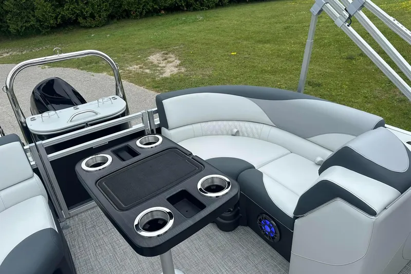 Slide: The Image of Luxurious seating area on 2025 Tahoe 2185 boat with cup holders and modern design. - 27