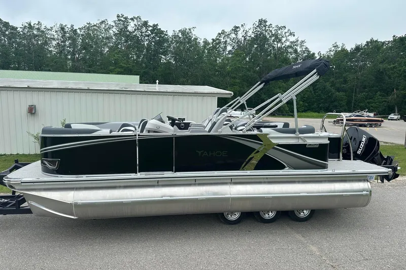 Slide: The Image of 2025 Tahoe 2185 pontoon boat with sleek black design and Suzuki outboard motor. - 3