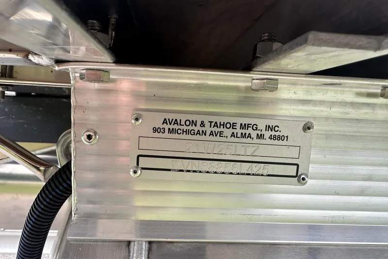 Slide: The Image of Metal plate on Tahoe 2185, 2025 model, showing manufacturer details and serial number. - 8