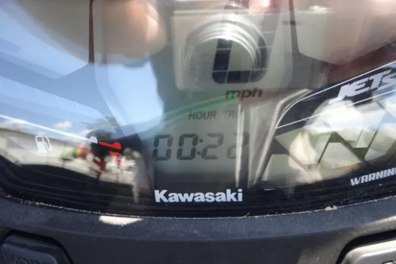 Slide: The Image of Close-up of 2020 Kawasaki STX160 dashboard displaying speed and hour meter. - 7