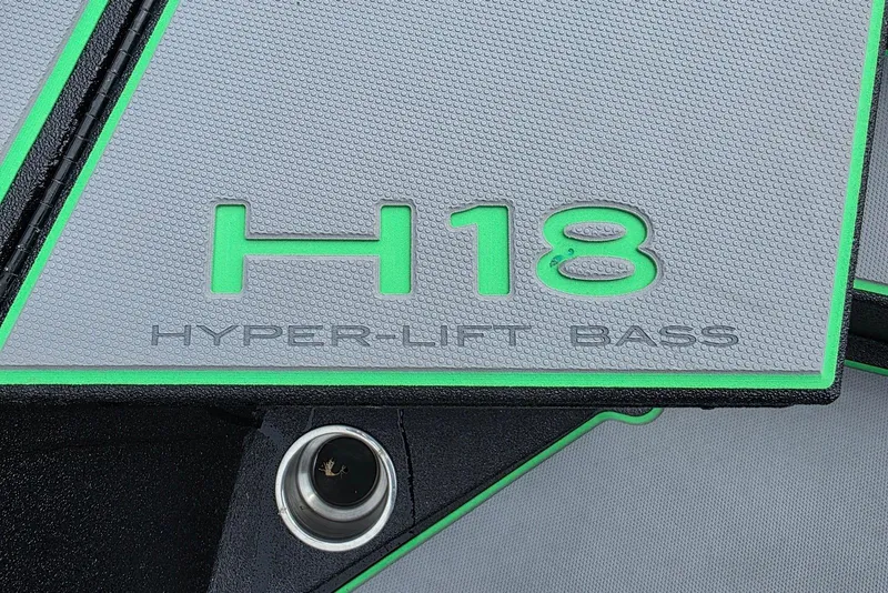 Slide: The Image of 2022 Xpress H18 Hyper-Lift Bass boat detail with green accents. - 12