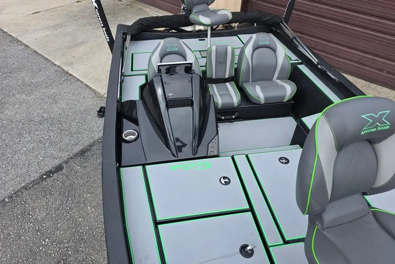 Slide: The Image of 2022 Xpress H18 Bass boat interior with Yamaha Vmax 115 SHO, featuring gray and green seating. - 14