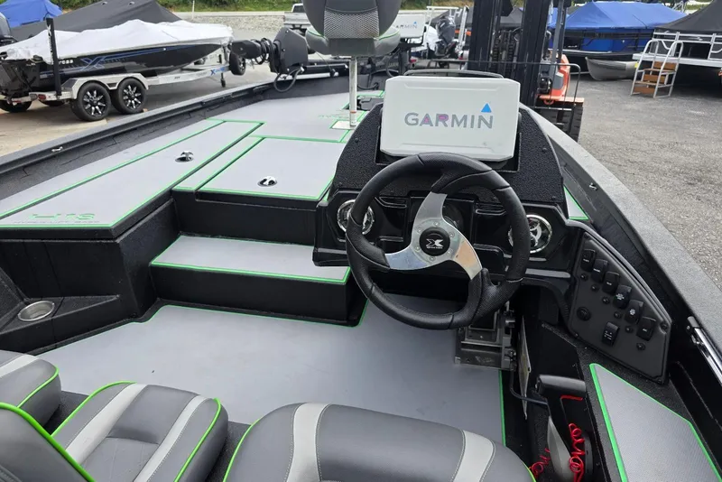 Slide: The Image of 2022 Xpress H18 Bass boat interior with Garmin system and Yamaha Vmax 115 SHO engine. - 16