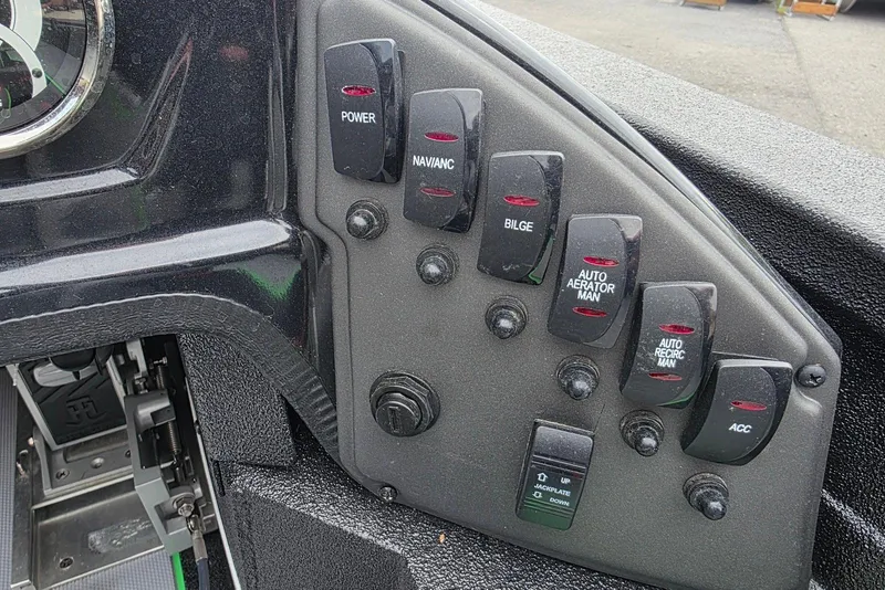 Slide: The Image of Control panel of 2022 Xpress H18 Bass boat with labeled switches and buttons. - 17