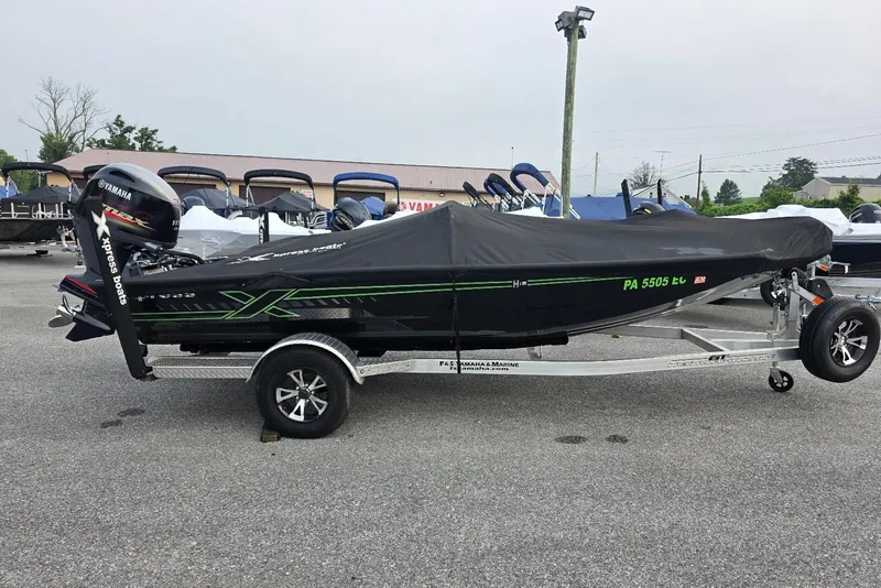 Slide: The Image of 2022 Xpress H18 Bass boat with Yamaha Vmax 115 SHO, covered and on trailer. - 2