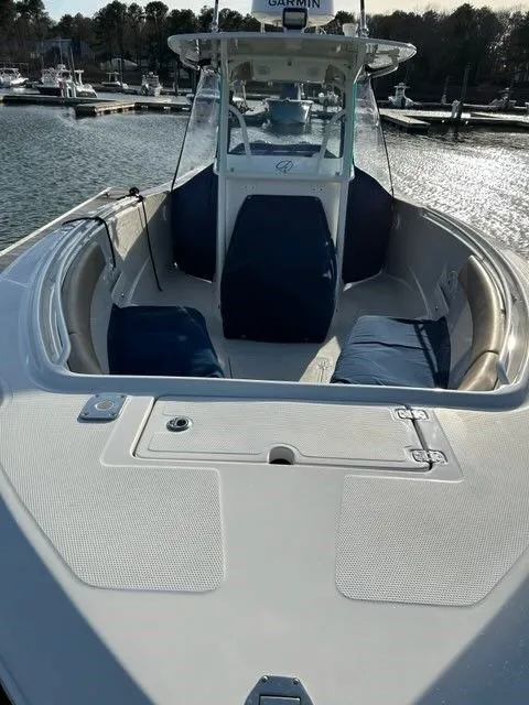 Slide: The Image of 2018 Sailfish 320 CC boat in harbor, front view. - 12
