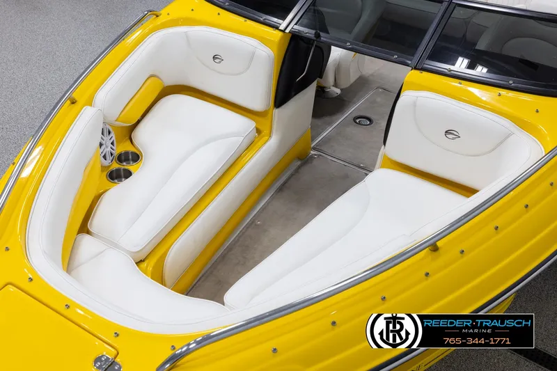 Slide: The Image of 2007 Crownline 21 SS boat interior with yellow exterior and white seating, Reeder-Trausch Marine logo. - 10