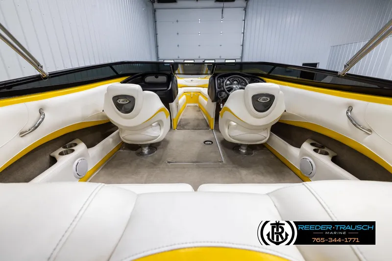 Slide: The Image of Interior of a 2007 Crownline 21 SS boat with white and yellow seating. - 13
