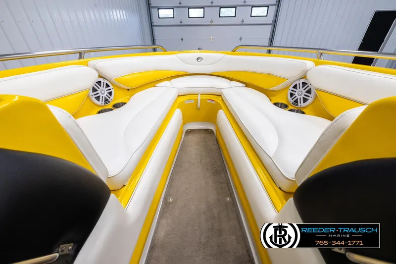 Slide: The Image of 2007 Crownline 21 SS boat interior with yellow and white seating, featuring speakers. - 15