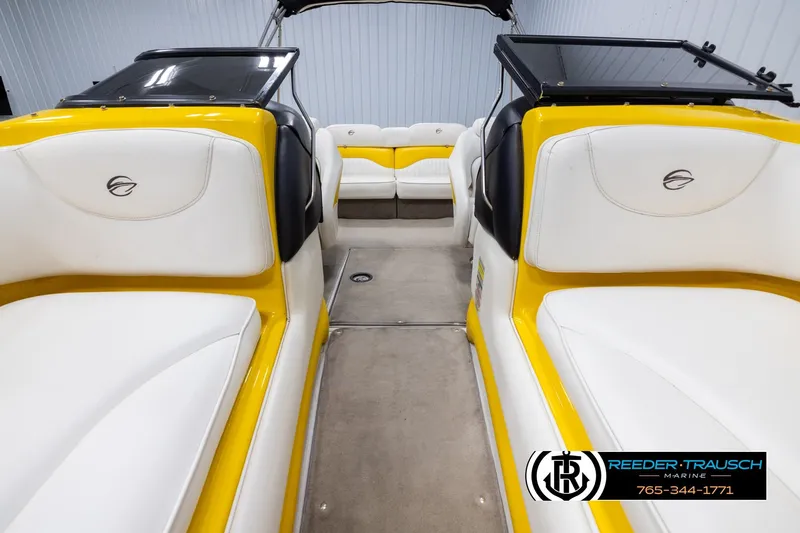 Slide: The Image of 2007 Crownline 21 SS boat interior with yellow and white seating, showcased by Reeder-Trausch Marine. - 16