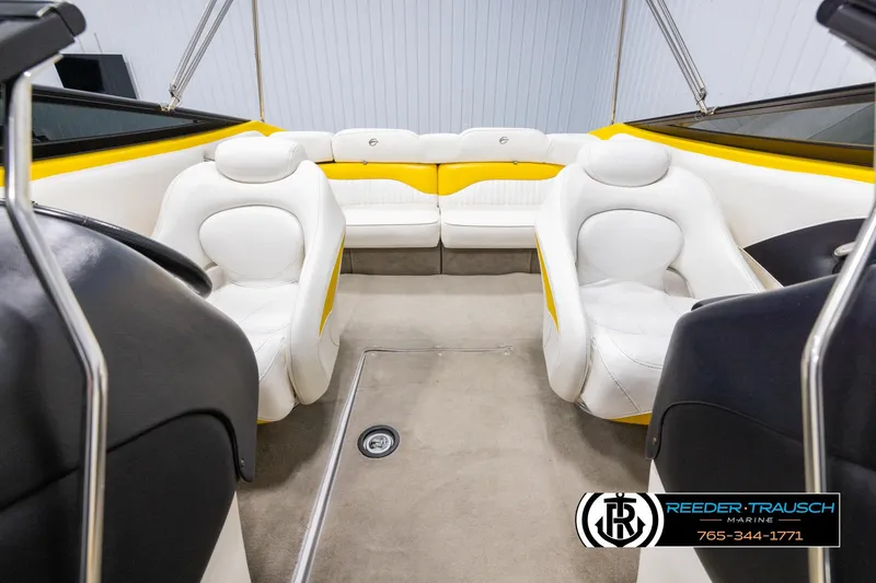 Slide: The Image of 2007 Crownline 21 SS boat interior with white and yellow seating, carpeted floor. - 17