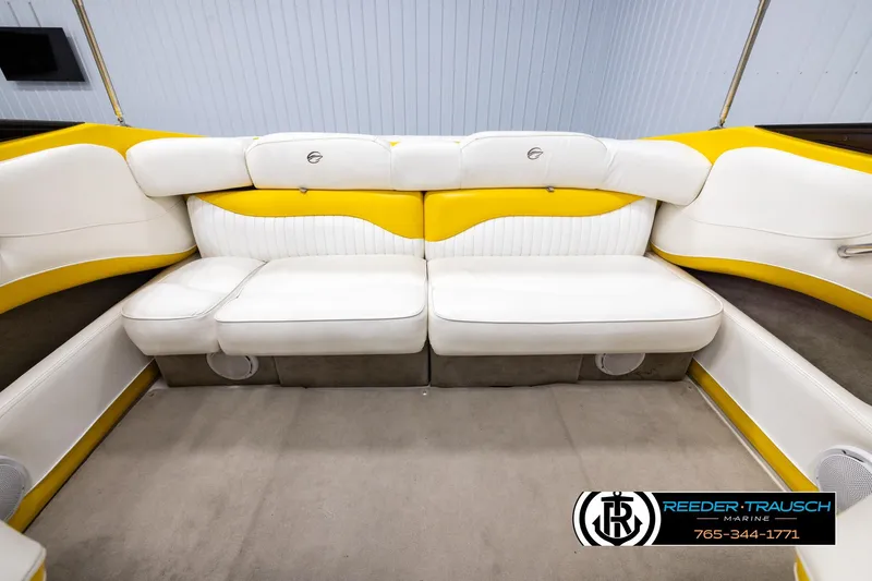 Slide: The Image of 2007 Crownline 21 SS boat interior with white and yellow seating, Reeder-Trausch Marine logo. - 18