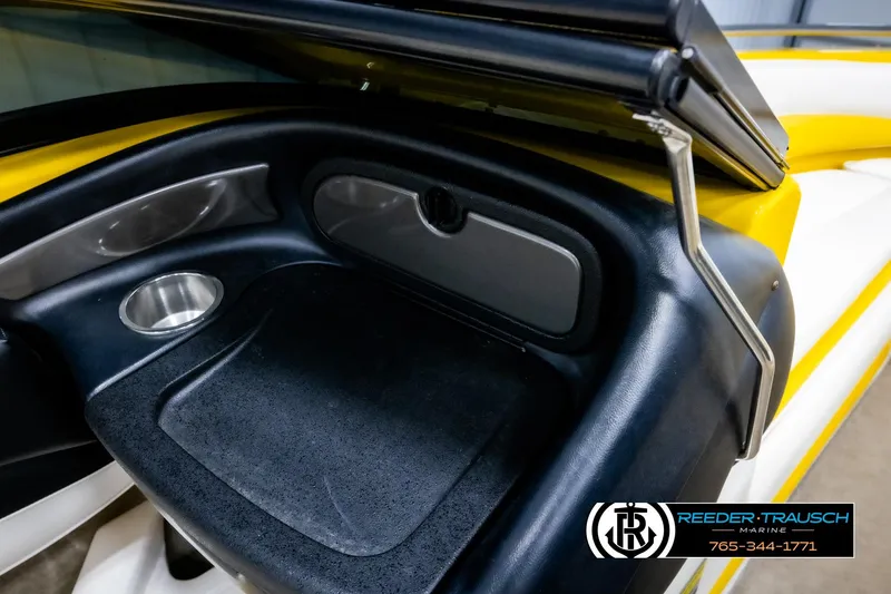 Slide: The Image of 2007 Crownline 21 SS boat interior with cup holder and storage compartment. - 21