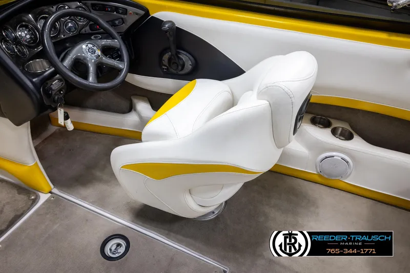 Slide: The Image of 2007 Crownline 21 SS boat interior with steering wheel and white-yellow seating. - 26