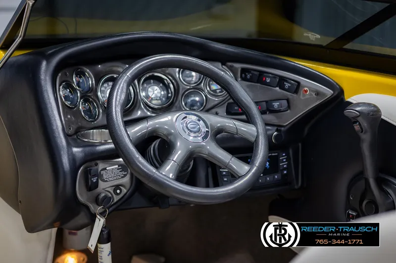 Slide: The Image of 2007 Crownline 21 SS boat dashboard with steering wheel and instrument panel. - 28